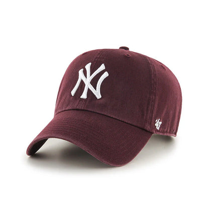 Maroon baseball cap with white logo on a white background