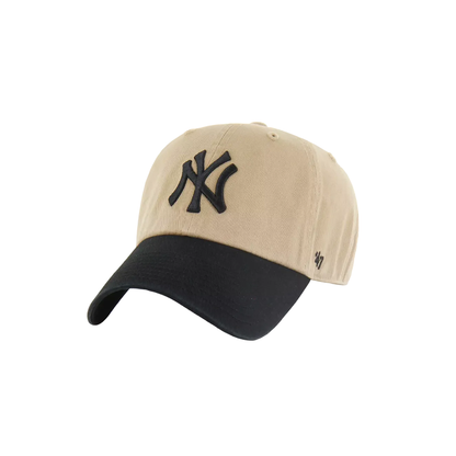 A New York Yankees baseball cap in beige and black, featuring the embroidered black NY logo on the front and a small black '47 brand logo on the side, set against a plain white background.