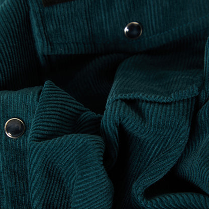 Close up of pearl snaps and green corduroy overshirt 