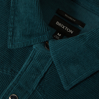 Close up of a green corduroy collar 