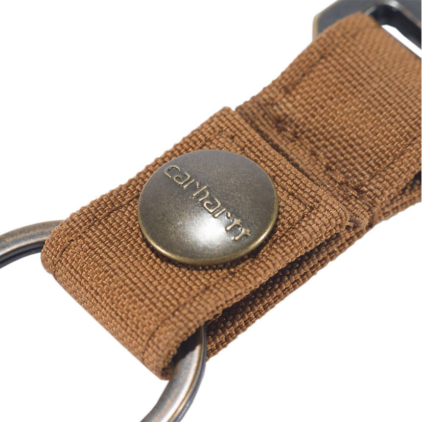 Brown woven keychain with Carhartt logo on a white background