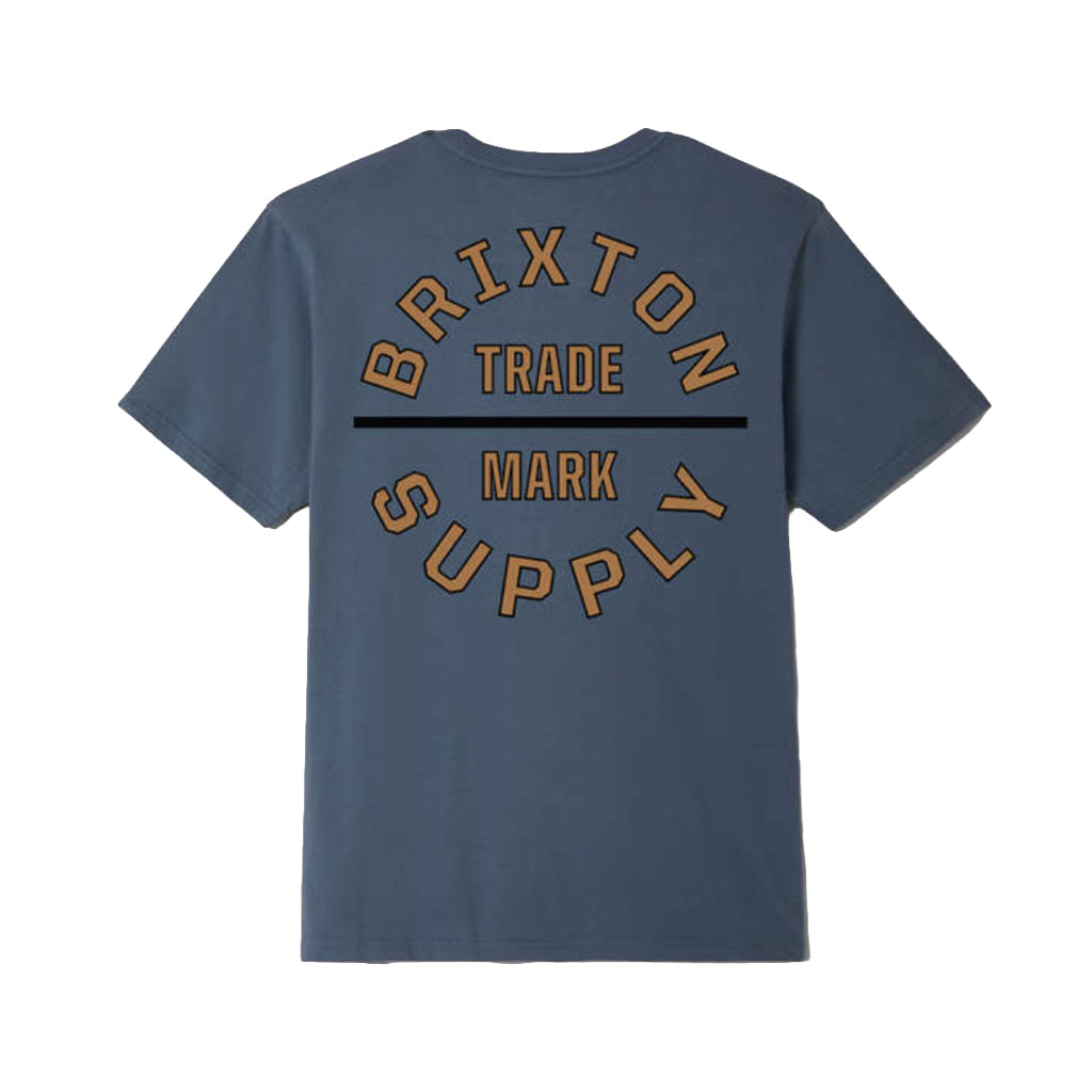 Blue t-shirt with 'Brixton Trade Mark Supply' text on the back against a white background