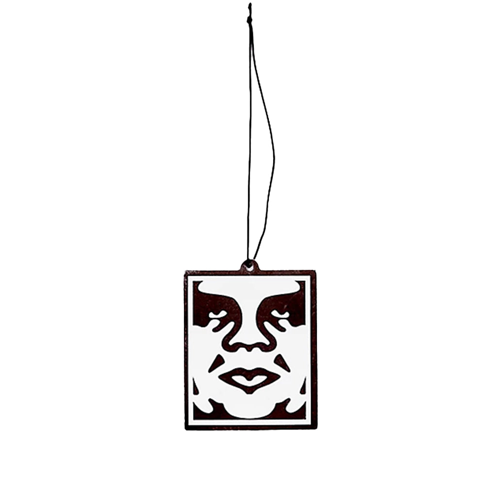 Decorative hanging face ornament with a black border on a white background