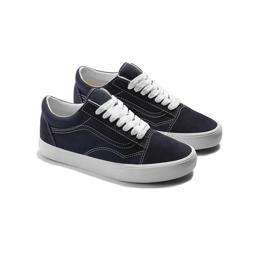 A pair of classic low-top canvas sneakers in navy blue with white laces and white rubber soles, shown on a clean white background.