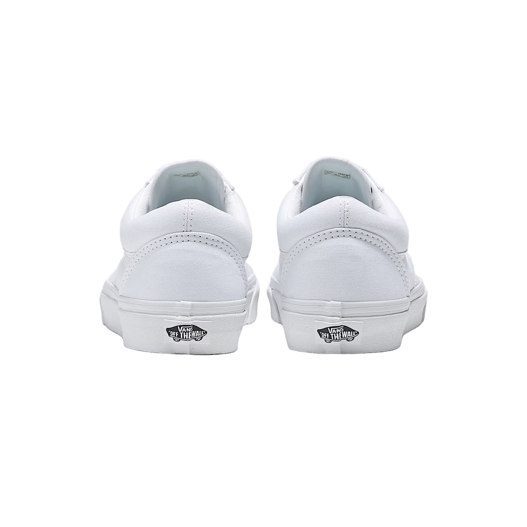 White sneakers with Vans logo on a light gray background