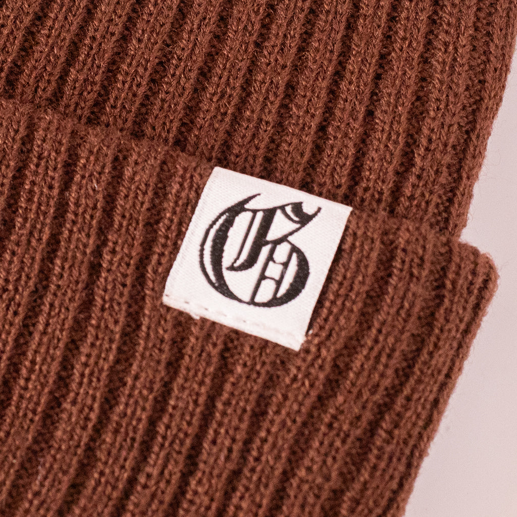 Close up of Old G logo on a brown beanie
