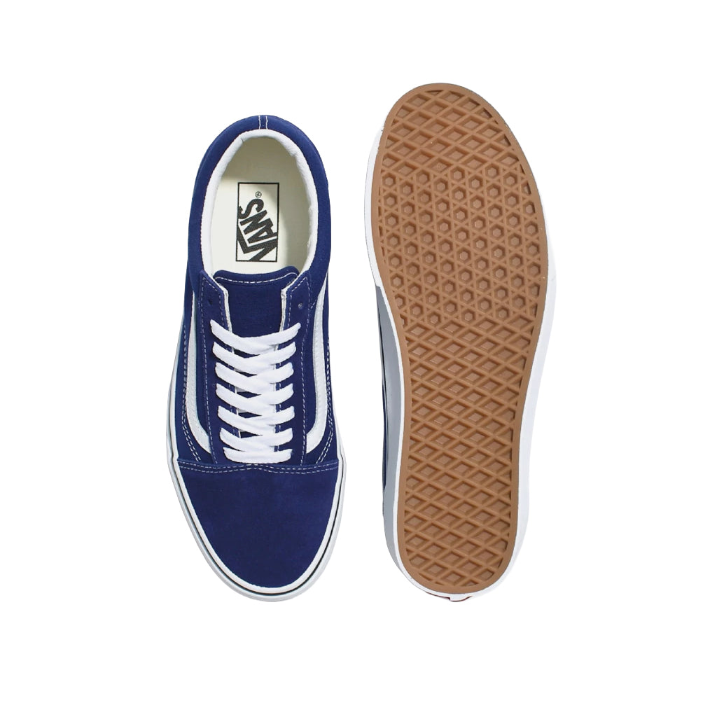Blue sneaker with white laces and brown sole on a white background