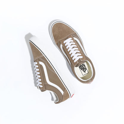 Pair of brown sneakers with white laces on a white background
