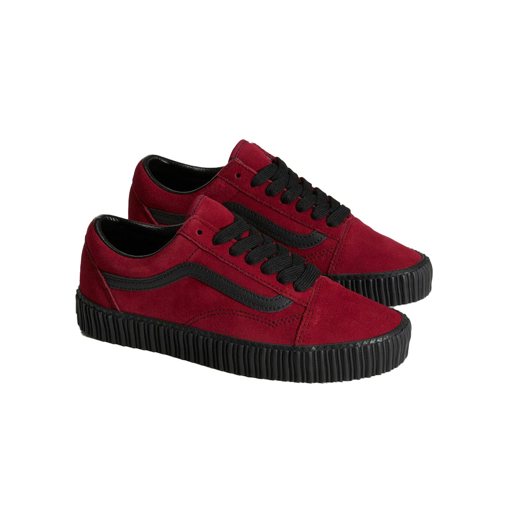 Red sneakers with black accents on a white background