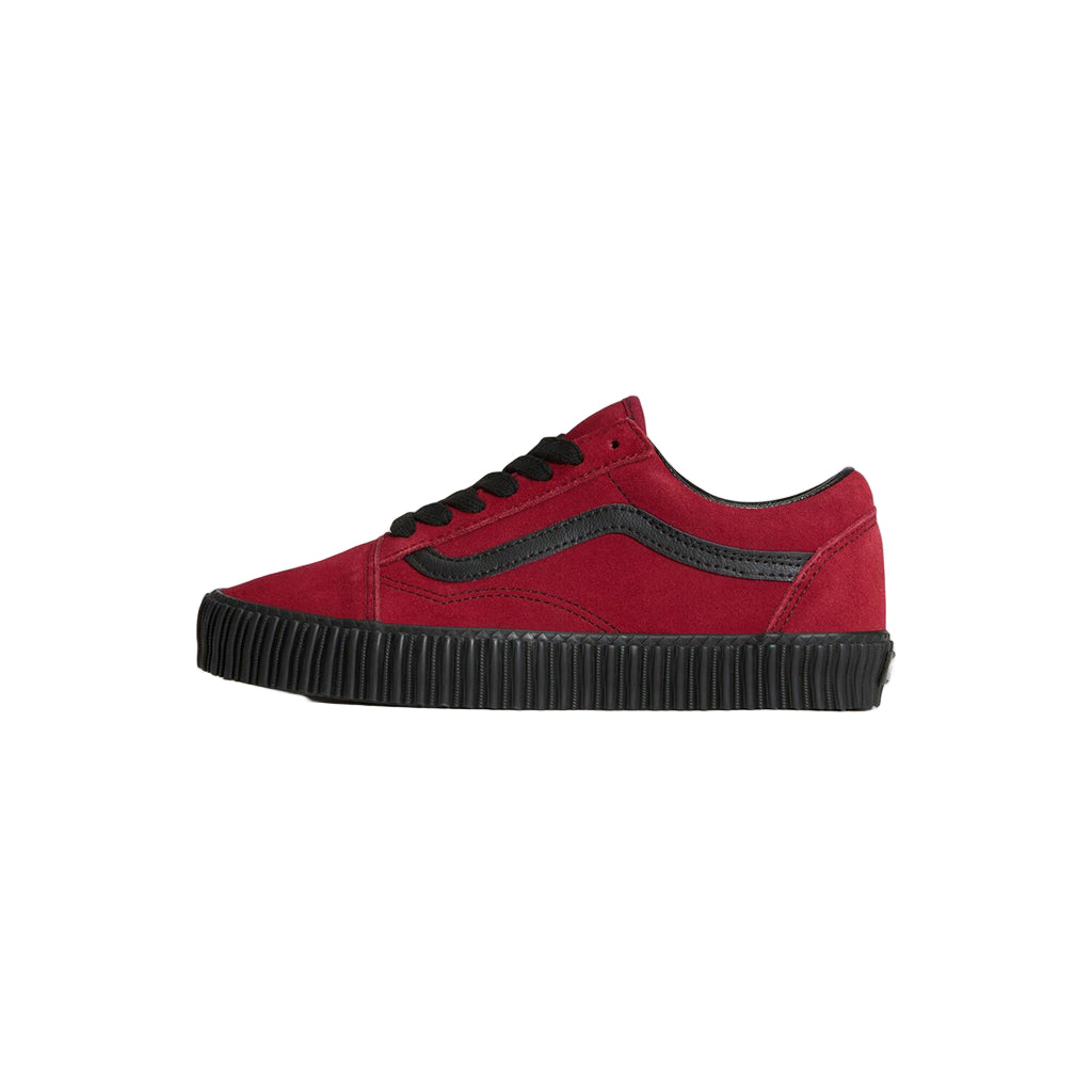Red sneaker with black sole on a white background