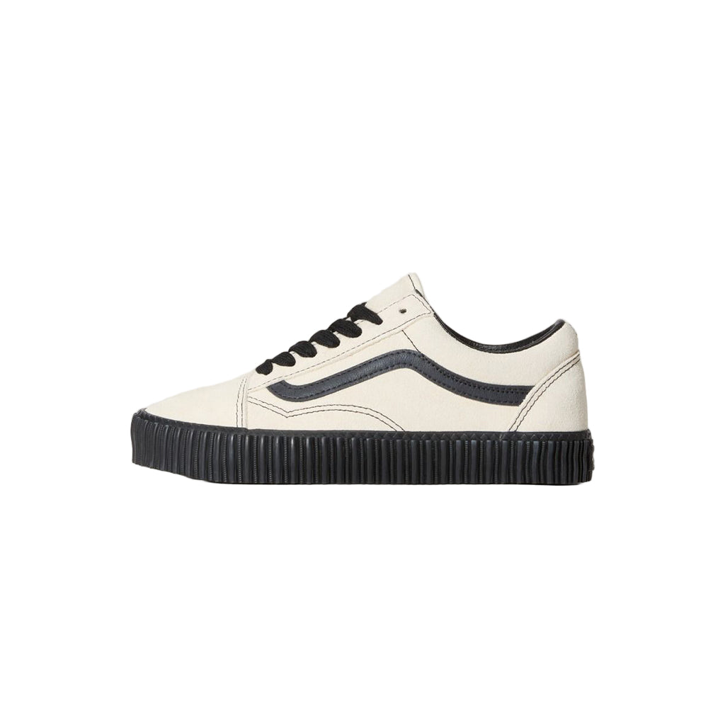 White sneaker with black accents on a light gray background