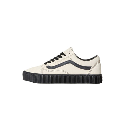 White sneaker with black accents on a light gray background