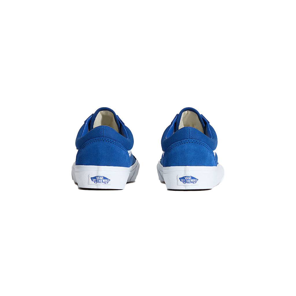 Pair of blue sneakers with white soles on a white background