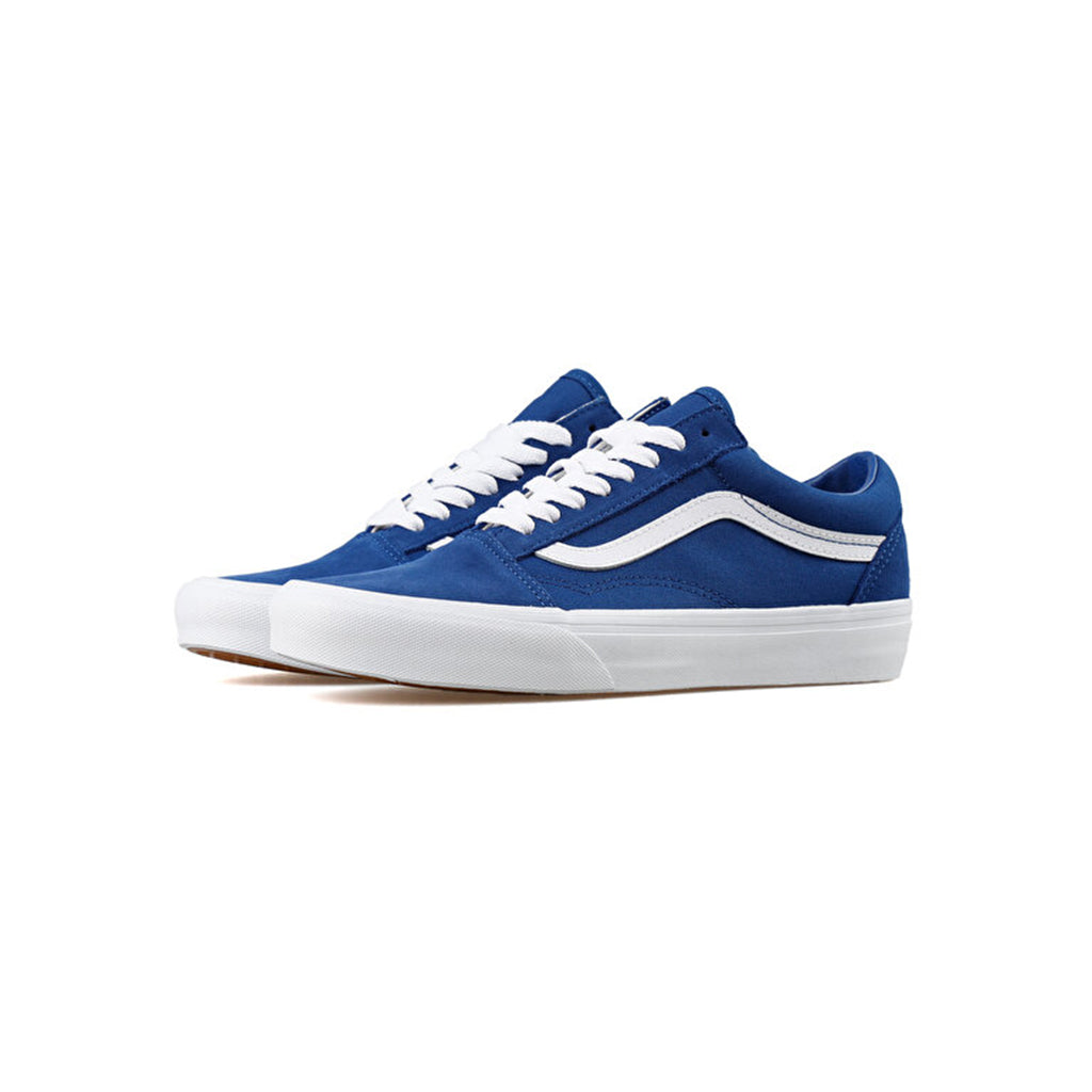 Blue sneakers with white soles on a white background