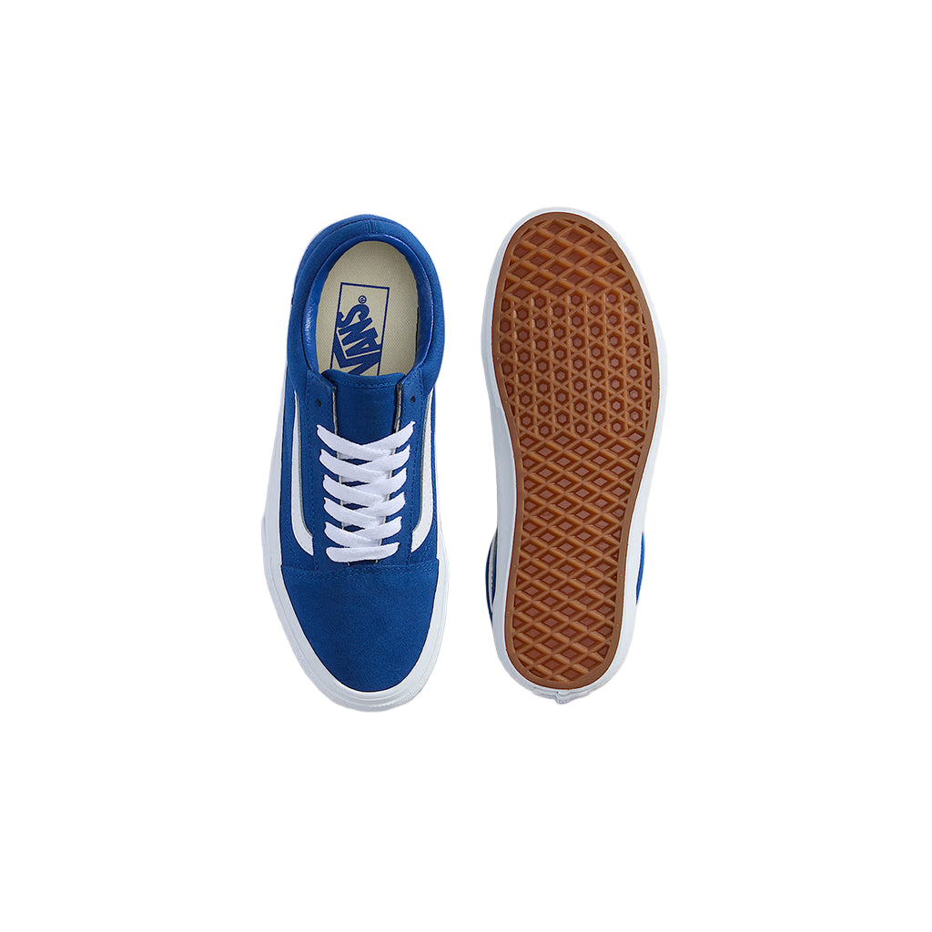 Blue sneaker with white laces and brown sole on a white background
