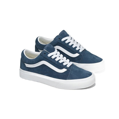 Pair of blue sneakers with white soles on a white background