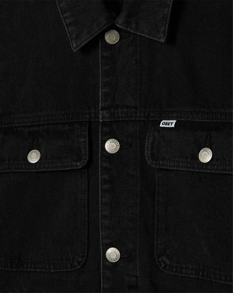 Black denim jacket with silver buttons and 'Obey' brand logo on a black background