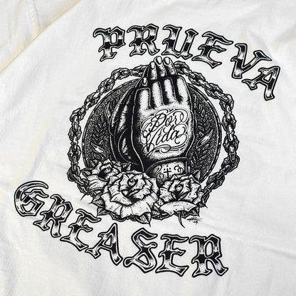 White t-shirt with black graphic design featuring a hand, chain, and roses on a white background