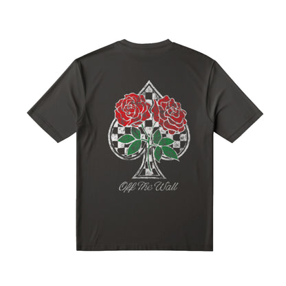 Black t-shirt with a design of a spade symbol with roses and 'Off The Wall' text on a white background