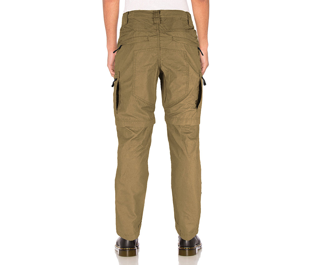 Khaki pants worn by a person on a white background