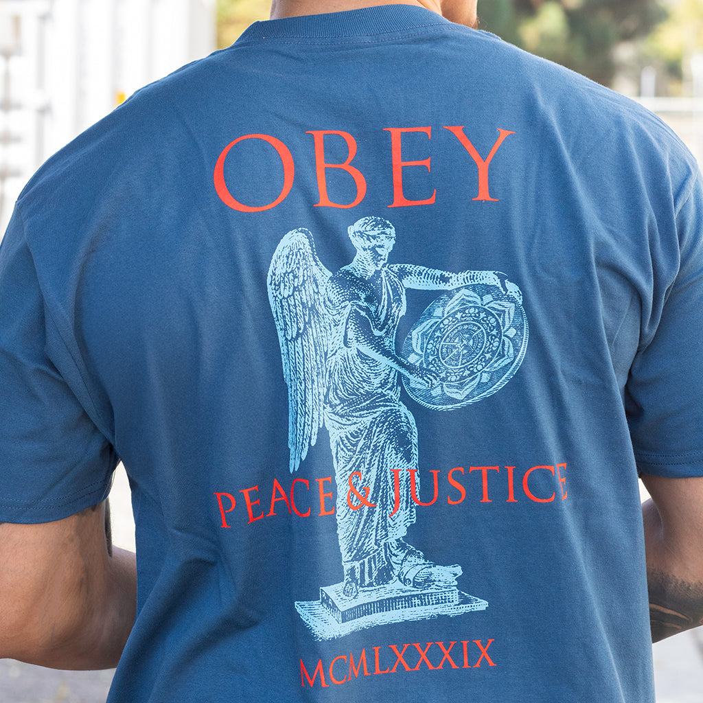 Blue t-shirt with 'OBEY' and 'PEACE & JUSTICE' design on the back