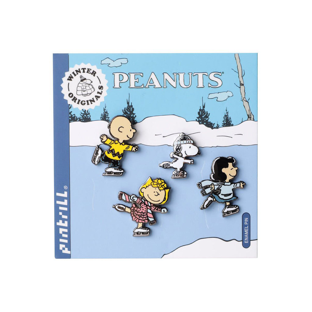 Peanuts-themed pins on a blue card with winter scene