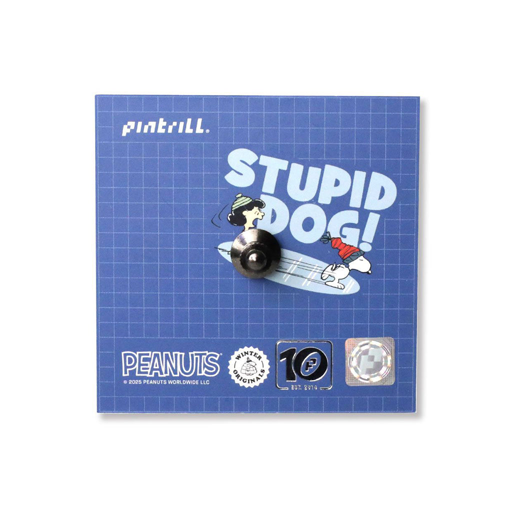 Pin with cartoon character and 'STUPID DOG!' text on a blue grid background, featuring Peanuts branding.