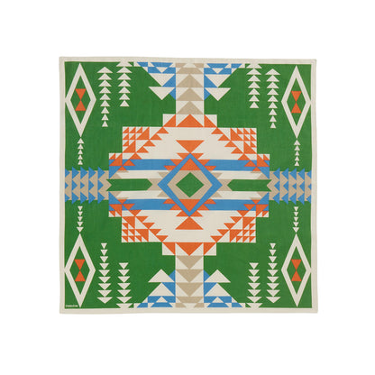 Geometric patterned bandana with a central design on a green background