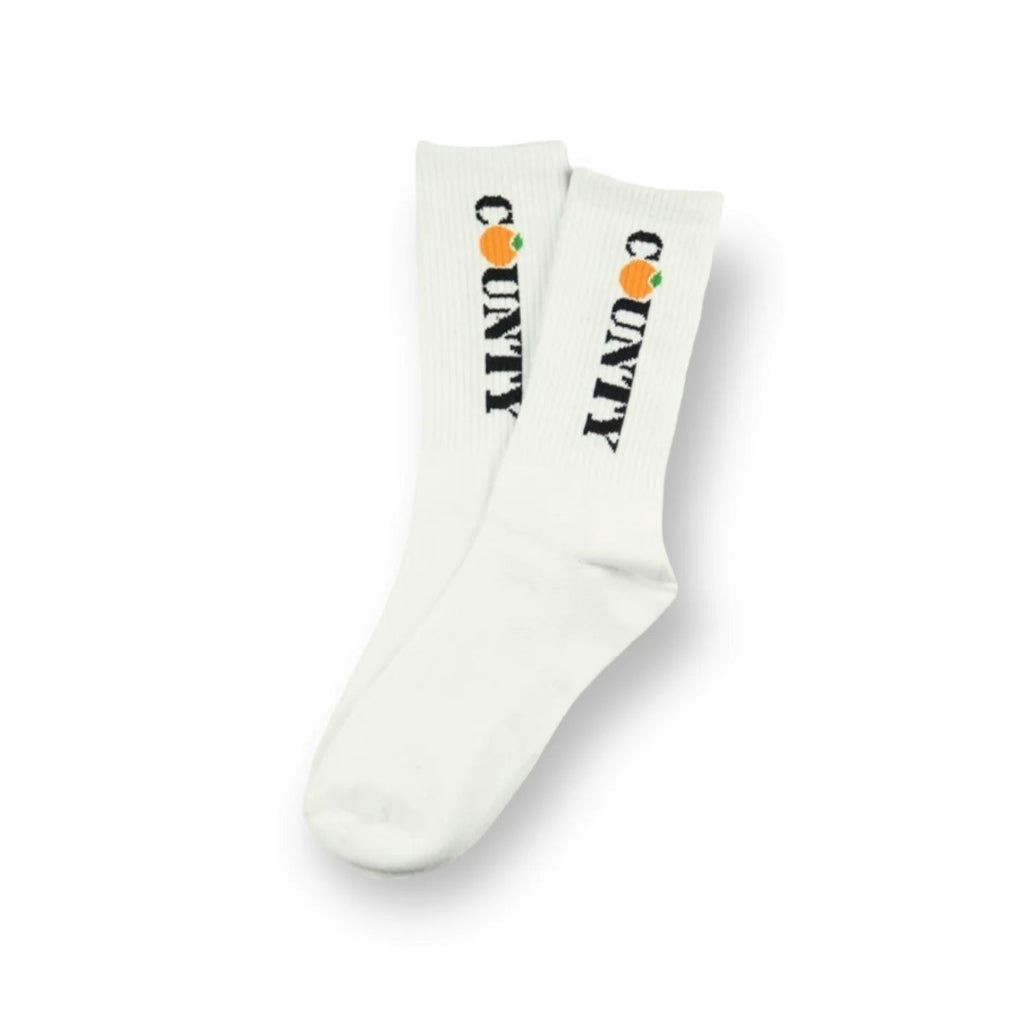 White socks with 'COUNTY' and orange graphics on a white background