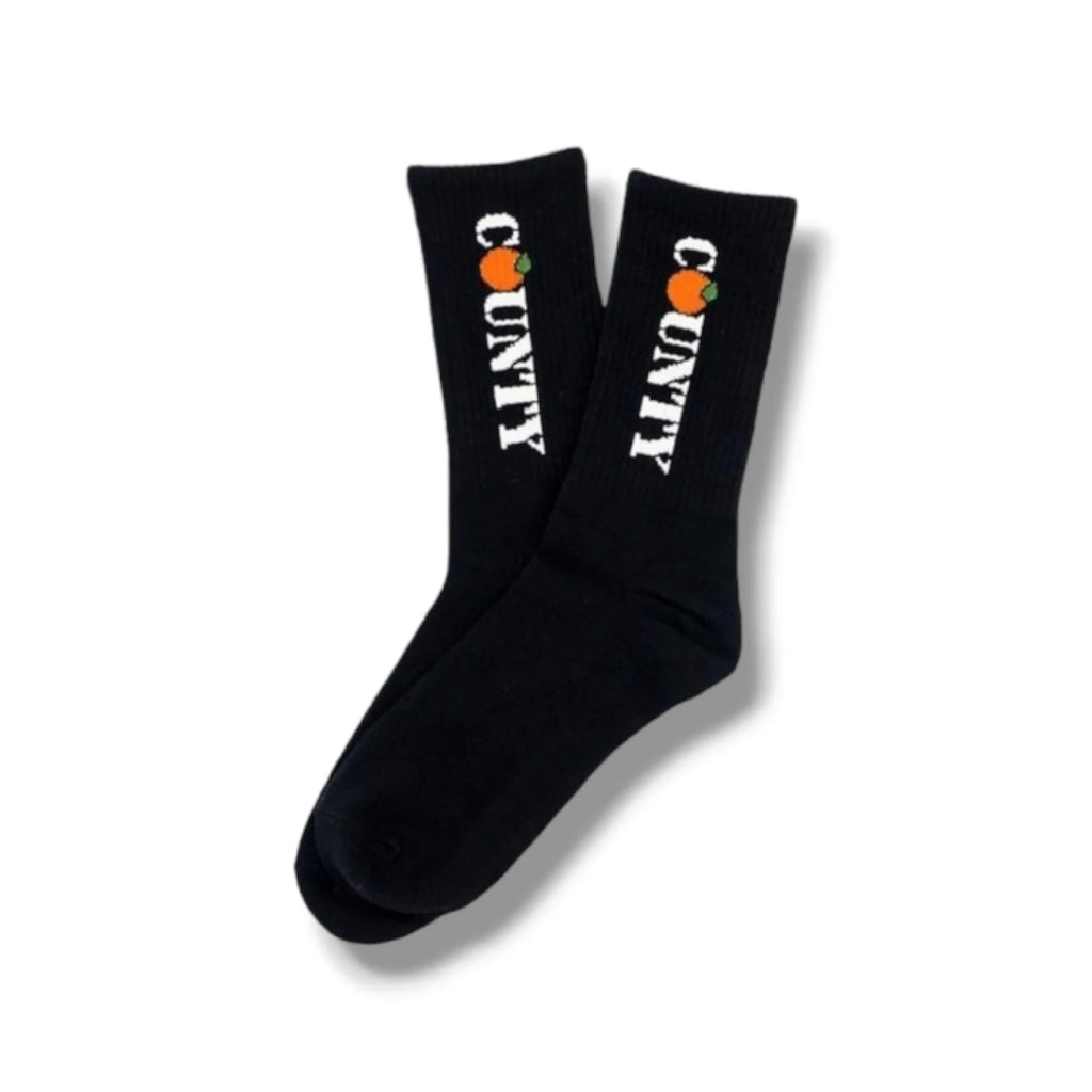 Black socks with white text and orange graphics on a white background