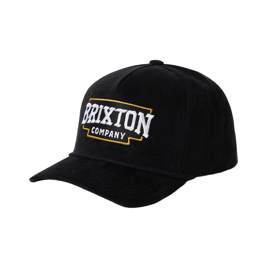 Black cap with Brixton Company logo on a light gray background