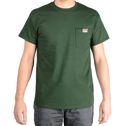 Green t-shirt with a small logo on a plain background