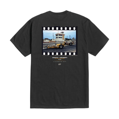 Black t-shirt with a graphic of a race track and cars on the back, on a white background.