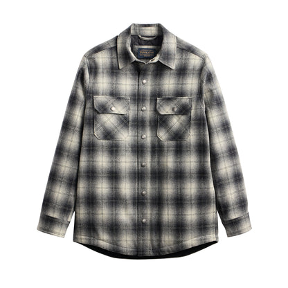Plaid shirt with button details on a white background