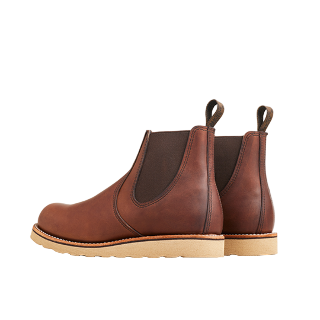 Pair of brown leather boots on a white background