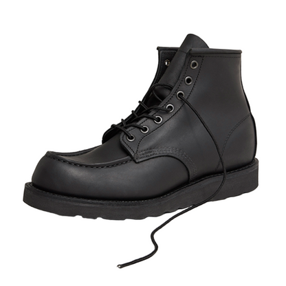 Black leather boot on a white background