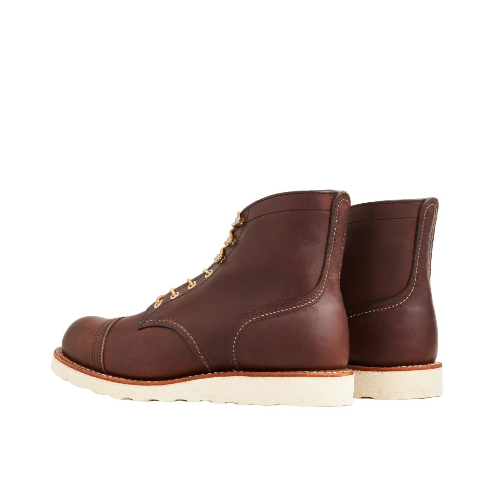 Pair of brown leather boots on a white background