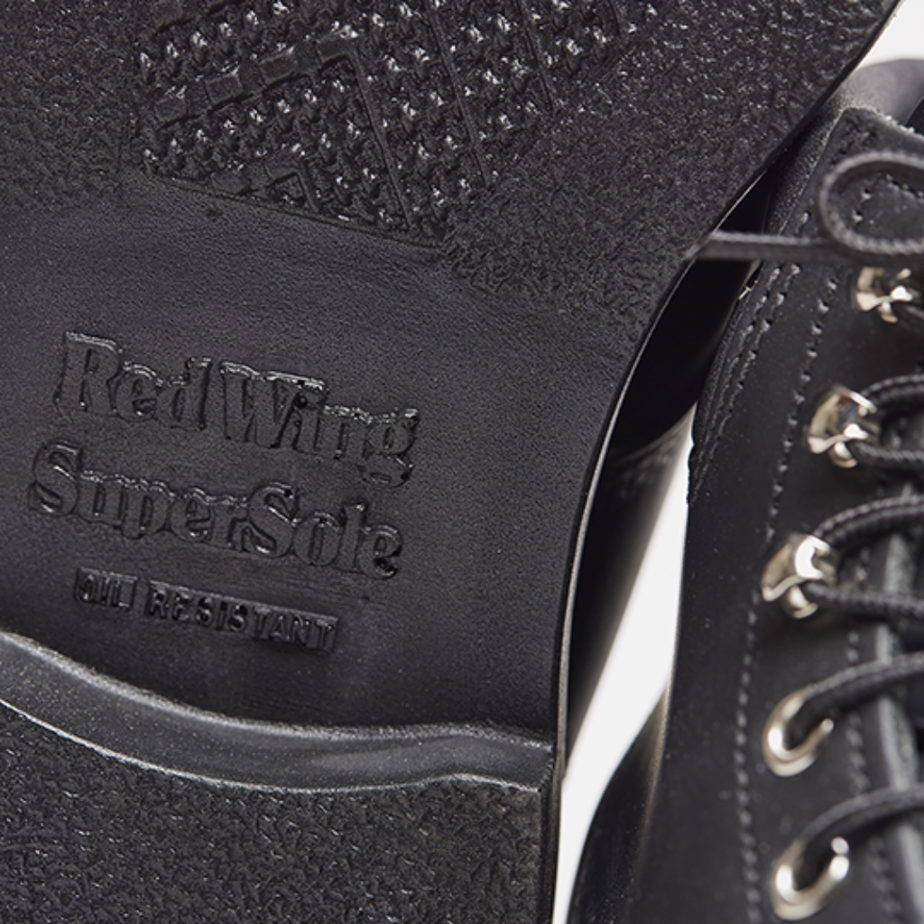 Close-up of a black boot sole with 'Red Wing Super Safe' branding.
