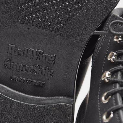 Close-up of a black boot sole with 'Red Wing Super Safe' branding.