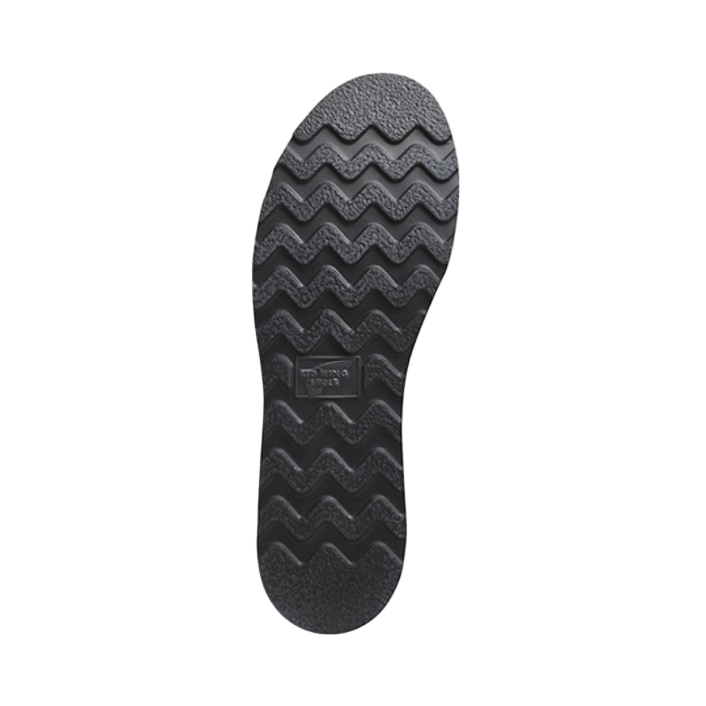 Black shoe sole with wavy pattern on a white background