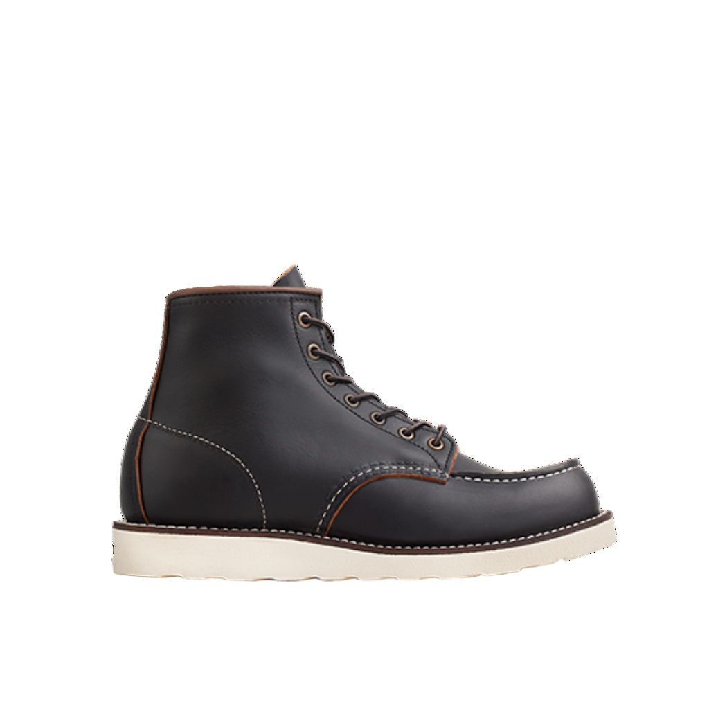 Black leather boot with white sole on a white background