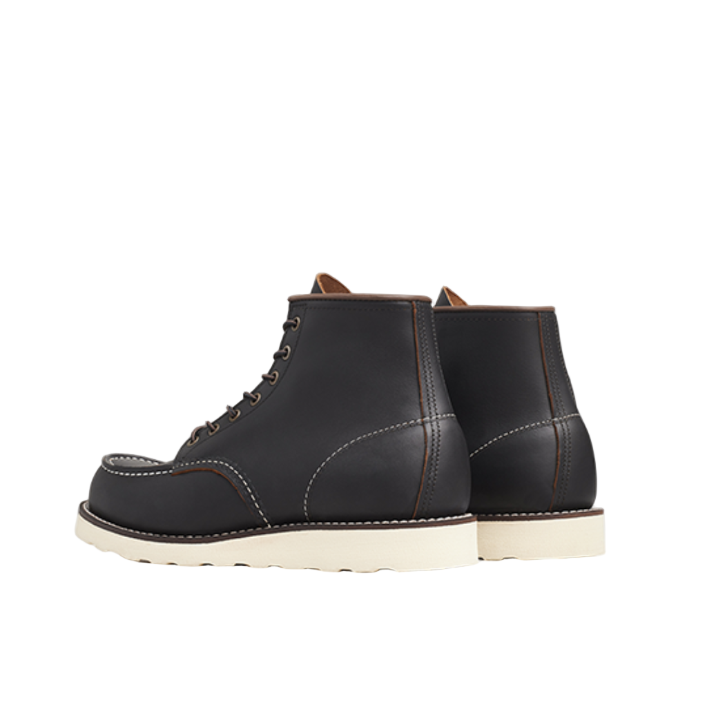 Pair of black leather boots on a white background