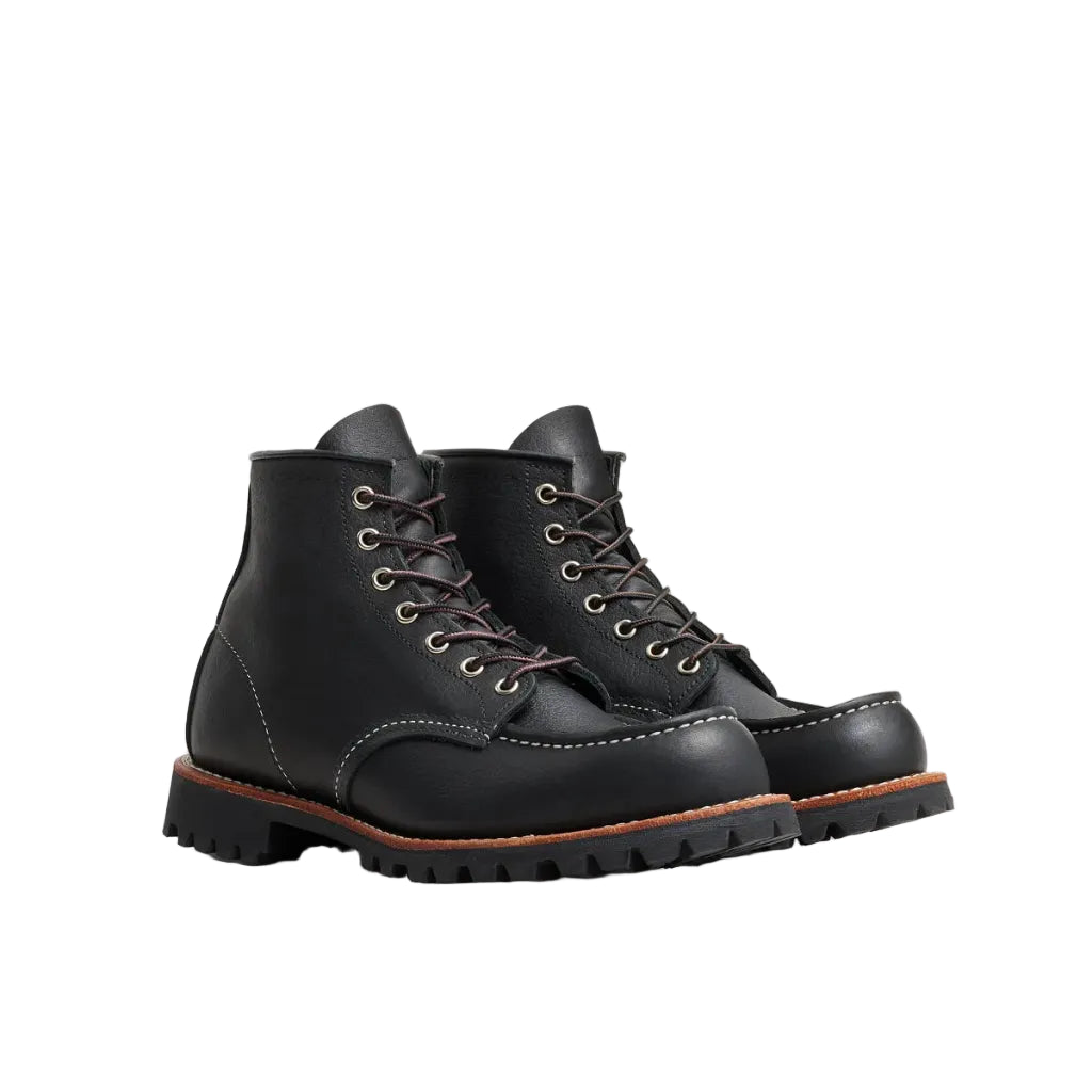 Pair of black leather boots on a white background