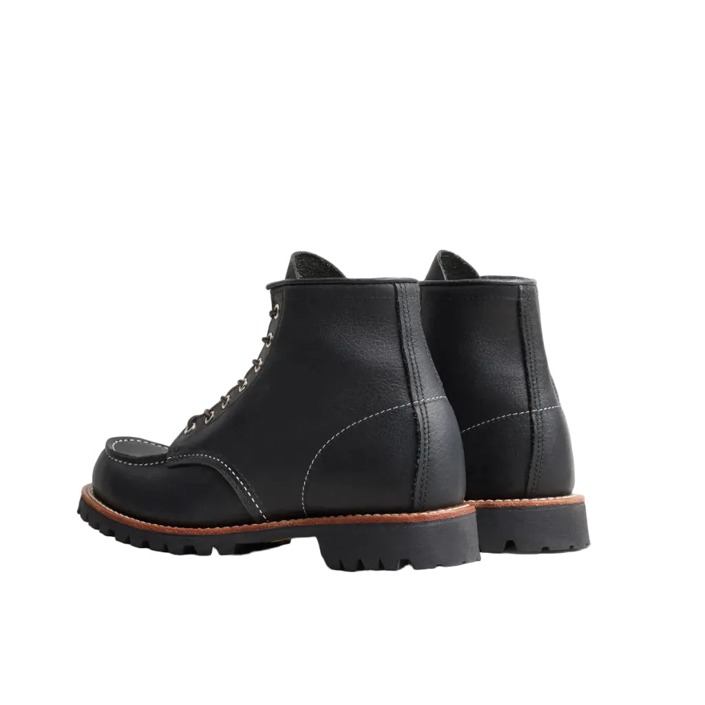 Black leather boots on a white background