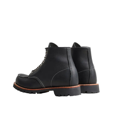 Black leather boots on a white background