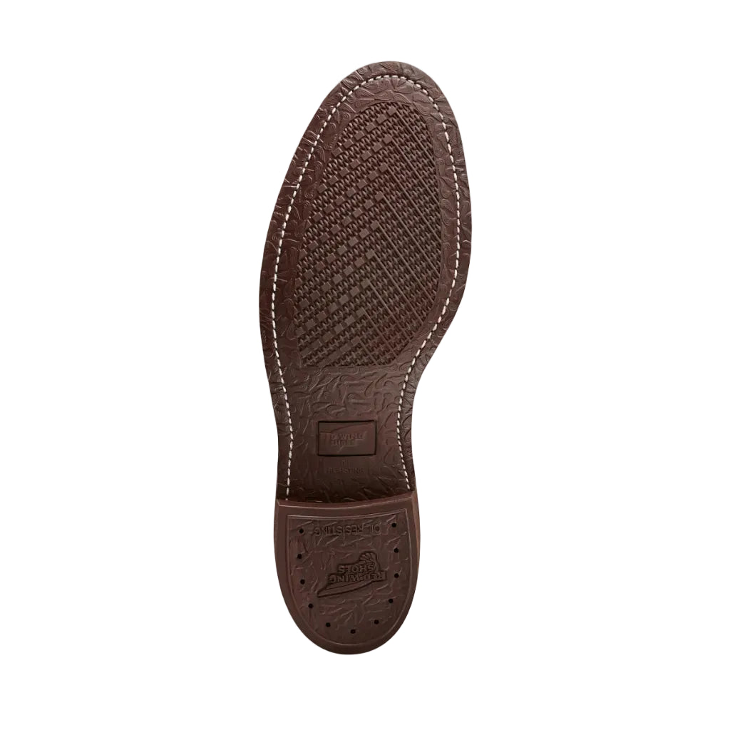 Brown shoe sole with textured pattern on a white background