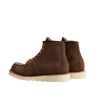 Pair of brown leather boots on a white background