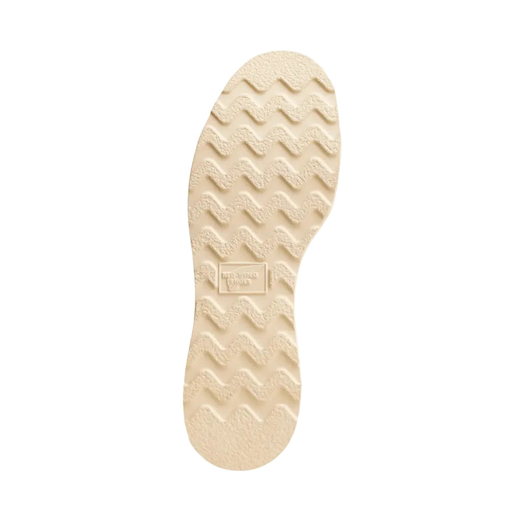 Beige shoe sole with brand logo on a white background