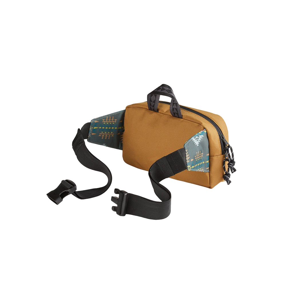 Brown waist bag with black strap on a beige background