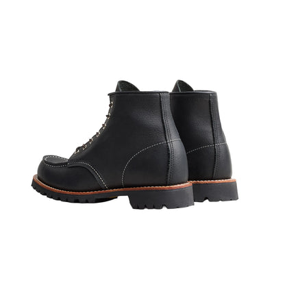 Black leather boots on a white background
